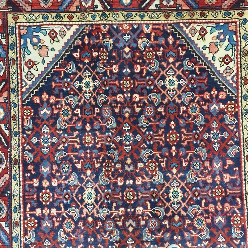 41 - A blue ground Persian carpet .
L 315 x W 160 cm approx.