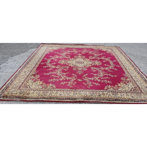 58 - A very large Red and Gold ground Carpet with large central medallion design.  405 x 322 cm approx.