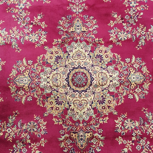 58 - A very large Red and Gold ground Carpet with large central medallion design.  405 x 322 cm approx.