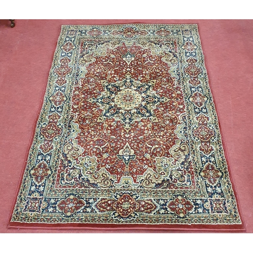 59 - A Red ground Carpet with central medallion design.
193  x 132 cm approx.