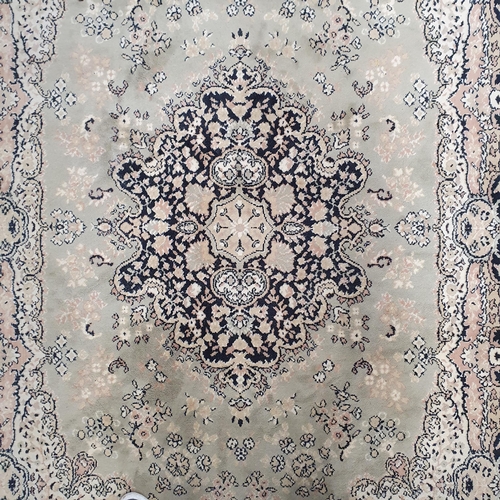 60 - A Green ground Carpet with central medallion design.  300 x 200  cm approx.