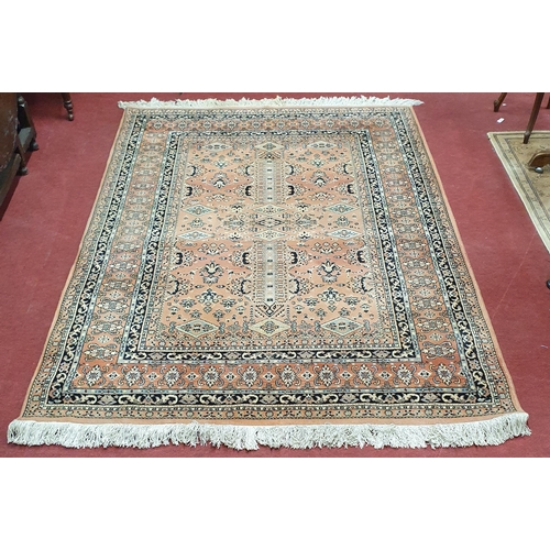 61 - An attractive Rust ground carpet with multi borders.  250 x 180 cm approx.