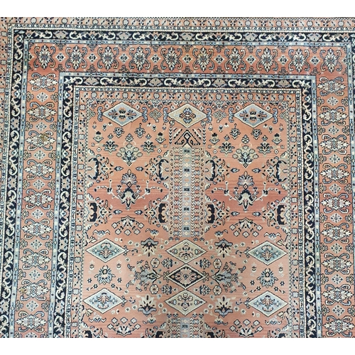 61 - An attractive Rust ground carpet with multi borders.  250 x 180 cm approx.