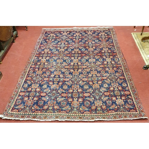 62 - A Blue ground Persian Carpet with repeating central medallion design, 260  x 164 cm approx.