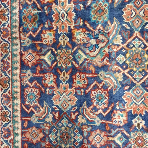 62 - A Blue ground Persian Carpet with repeating central medallion design, 260  x 164 cm approx.