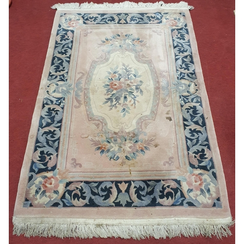 63 - A Pink Ground Oriental Carpet. W 120  cm approx.