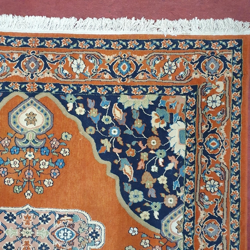 65 - A Rust ground Turkish Wool blend Carpet. 
300 x 200  cm approx.