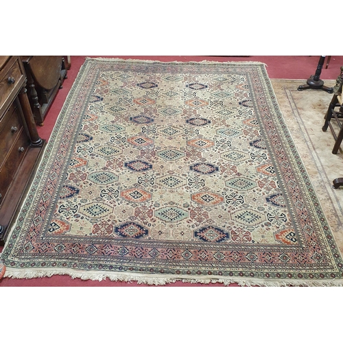 66 - A Cream ground Carpet with repeating central medallion design.  340 x 240  cm approx.