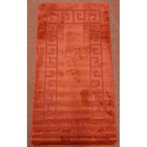 68 - A Red ground Rug as new.   150 x 80 cm approx.