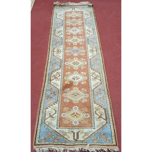 70 - A Cream ground Runner with Aztec design .
80 x 28 cm approx.