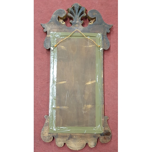 452 - A 19th Century Irish Mahogany Pier Mirror with fleur de lys and pediment cartouche top and highly ca... 