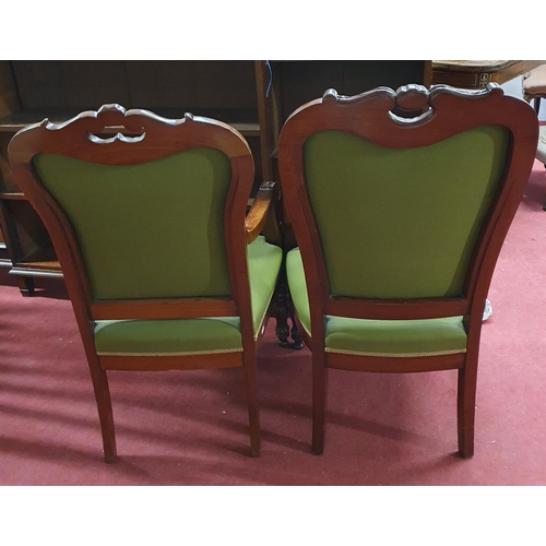 533 - A superb pair of 19th Century Mahogany Armchairs with highly carved back and fronts on turned fluted... 