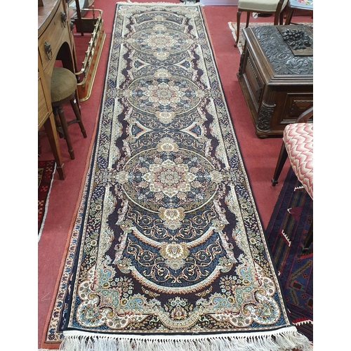 78 - A deep ground full pile fine woven Persian cream ground Runner with a bespoke medallion design,
W 10... 