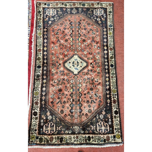 86 - A Red ground Persian Shiraz village Rug. 178 x 102 cm approx.