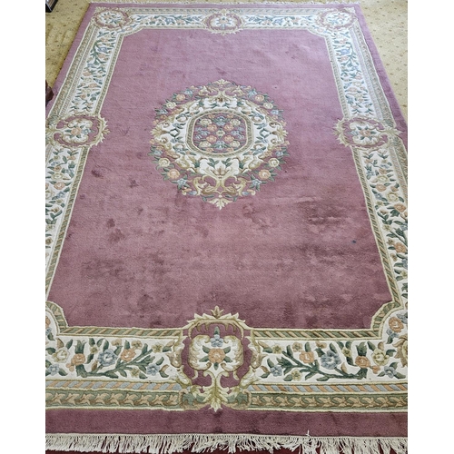 88 - An extremely large Indian pink ground Carpet with central medallion design and multi borders.
L 460 ... 