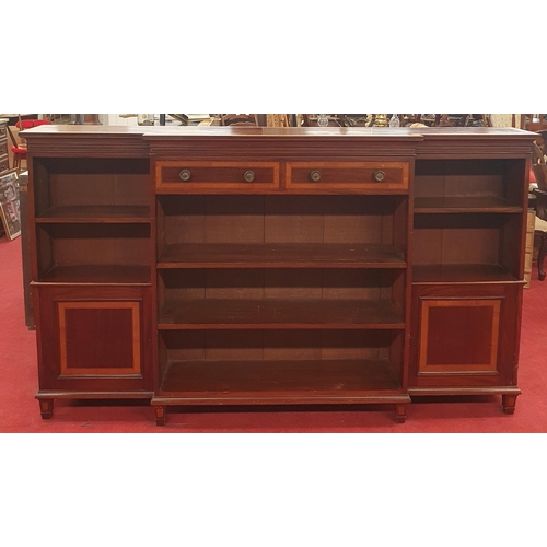 31 - An Edwardian Inlaid Mahogany break-front open bookcase in the George III style, fitted two frieze dr... 