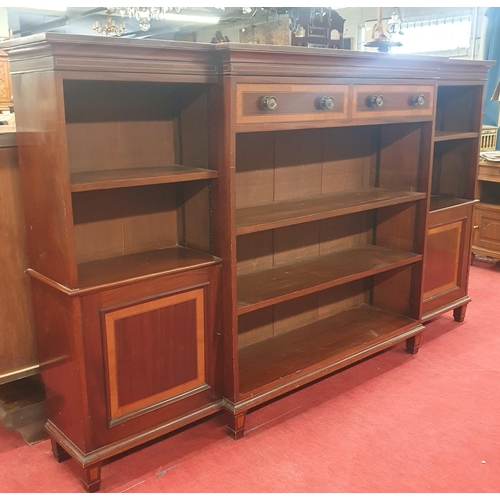 31 - An Edwardian Inlaid Mahogany break-front open bookcase in the George III style, fitted two frieze dr... 