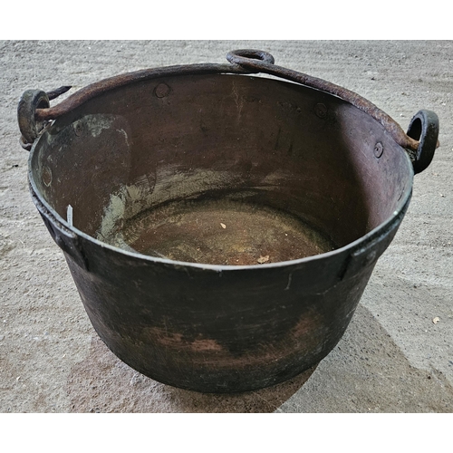 285 - A set of three 19th Century Brass Cauldrons with heavy cast Iron handles.