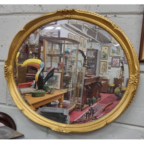 18 - A good oval Gilt bevelled edge Mirror with moulded outline. 55 x 65 cm approx.