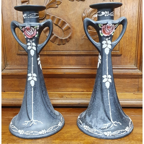 167 - A collection of items to include a good pair of Shelly Ebonised Candlesticks along with a pair of br... 