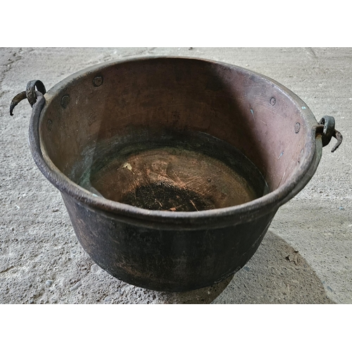 285 - A set of three 19th Century Brass Cauldrons with heavy cast Iron handles.