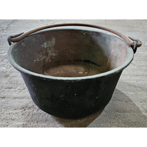 285 - A set of three 19th Century Brass Cauldrons with heavy cast Iron handles.