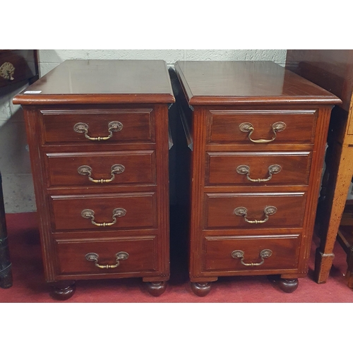 107 - A good pair of Mahogany bedside Cabinets with four graduated drawers with brass swan neck handles. W... 