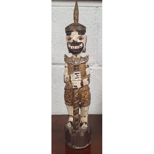 108 - An unusual hand painted Inca style Figure along with an Oriental style figure on a timber base. H 44... 