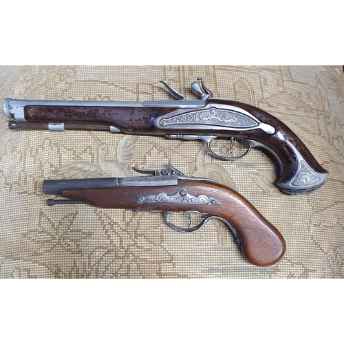 116 - Three reproduction Flintlock Pistols.