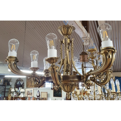 154 - A large Metal eight branch Chandelier.
 H 65 x D 83 cm approx.