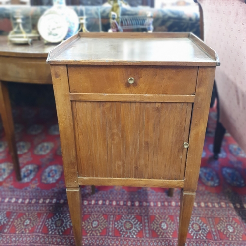 210 - A 19th Century Walnut single door Side Cabinet with single frieze drawer and tambour door base on sq... 