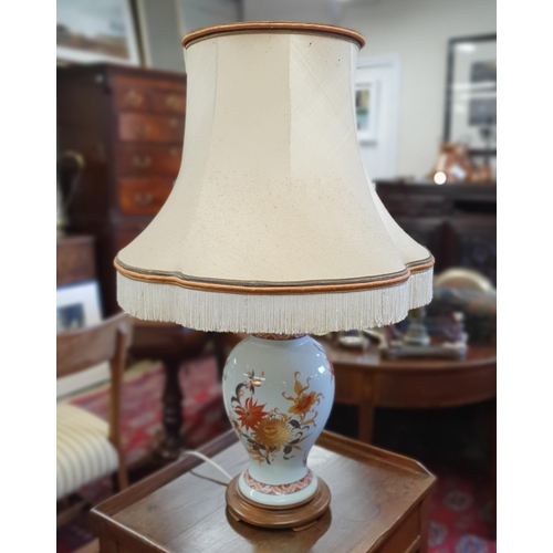 211 - A good hand painted Oriental Table Lamp of bulbous form with shade. H 45 cm approx.