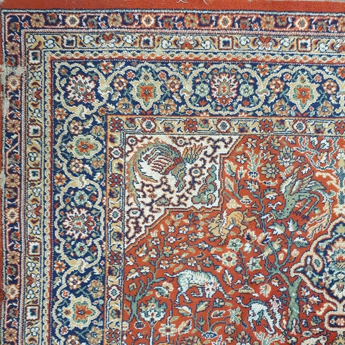 253 - A red and blue ground Carpet with multi borders and unique central medallion design. 290 x 200 cm ap... 