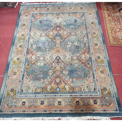 266 - A good green ground Carpet with multi borders and Aztec style design. 200 x 280 cm approx.