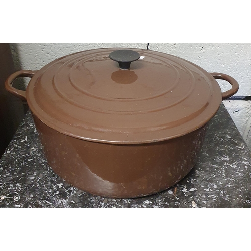 41 - Two large brown ground Le Creuset Saucepans with lids. D 27, 23 cm approx.