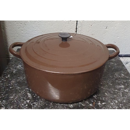 41 - Two large brown ground Le Creuset Saucepans with lids. D 27, 23 cm approx.