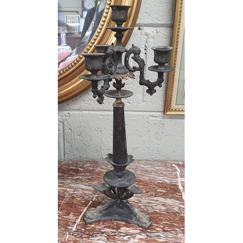 52 - A 19th Century classical three branch Candlestick.
H 41 cm approx.