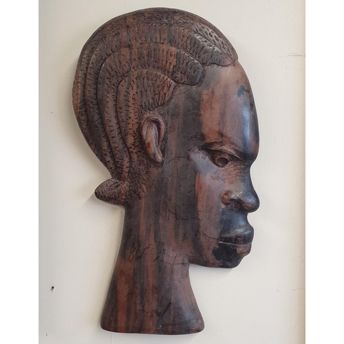 55 - A good quantity of Hardwood figural African Heads.