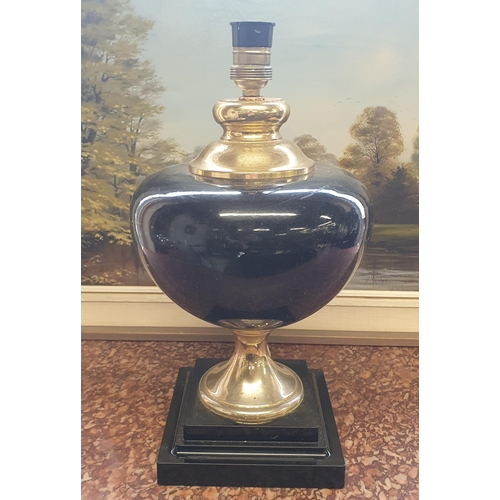 67 - A large bulbous Ebonised Table Lamp. H 40 cm approx.