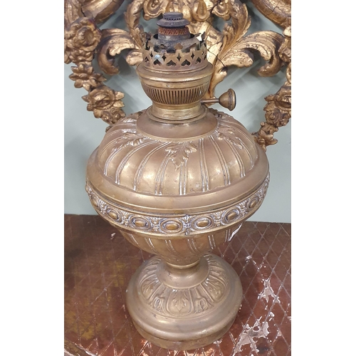 8 - A good late 19th Century Brass embossed Oil Lamp. H 31 cm approx.