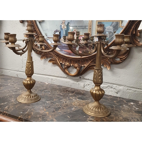 87 - A good pair of early 20th Century heavy Brass four branch Candelabra. H 34 cm approx.