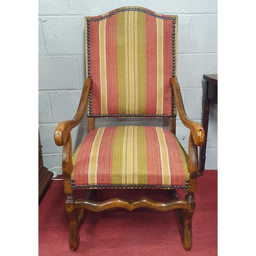 93 - A good 19th Century Walnut Armchair with carved front supports and studded upholstered seat and back... 