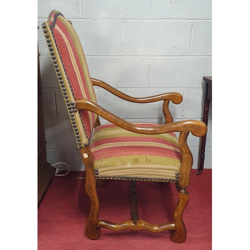 93 - A good 19th Century Walnut Armchair with carved front supports and studded upholstered seat and back... 