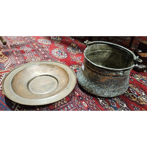 36A - A 19th Century Copper Charger and an 18th Century Copper Jam Pan. D 33, 22 cm approx.