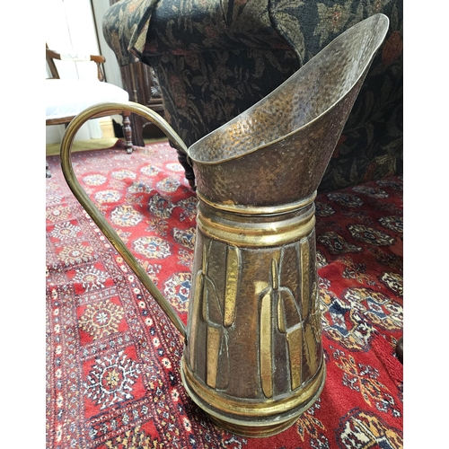 37A - A good 19th early 20th Century large Copper and Brass Water Jug with embossed outline. H 57 cm appro... 