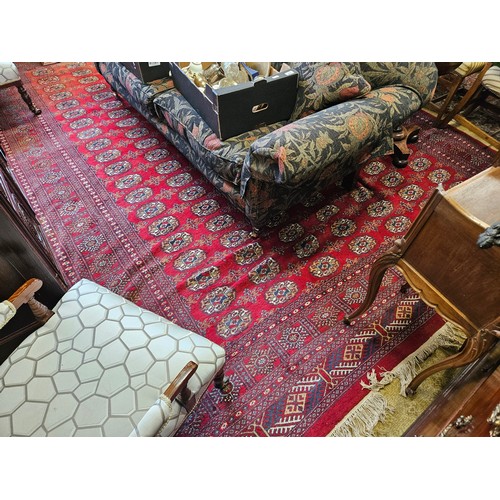 201 - A large Iranian red ground Carpet with multi borders and unique central medallion design. 280 x 380 ... 