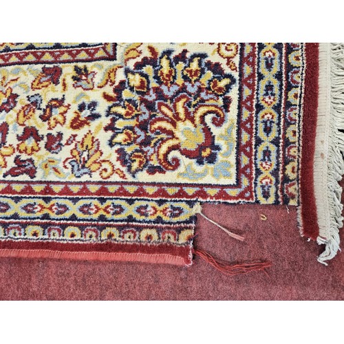 90 - A large red ground Carpet with muti borders and unique central medallion design. (faults to the edge... 