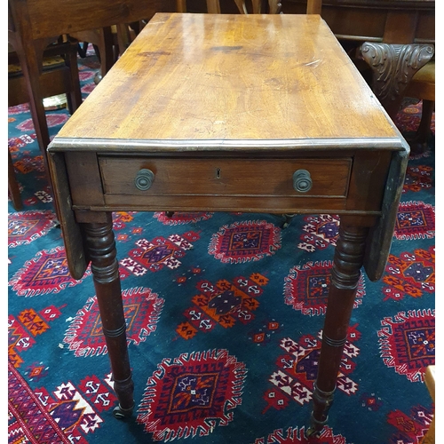 1377 - A late 19th Century Mahogany dropleaf Table with single frieze drawer on turned supports and casters... 