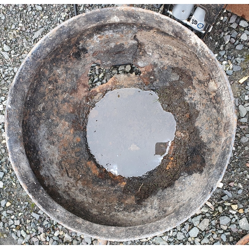 1410 - An extremely large cast Iron Skillet with lid, damage to the lid. H 48 x D 52 cm approx.