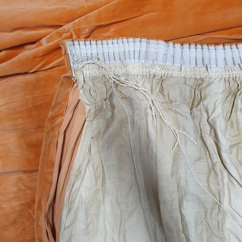 1469 - A Pair of Orange coloured  Lined Velvet Curtains.
Pleated Top Width 125 x 207 Length cm approx.